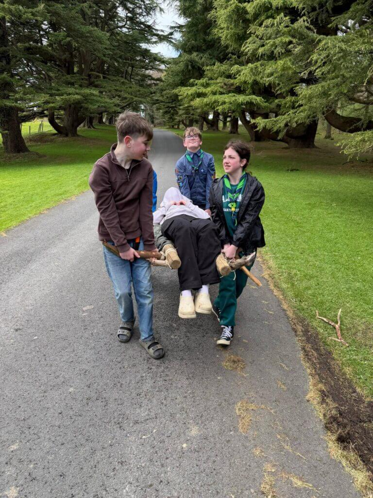 Scouts using a stretcher